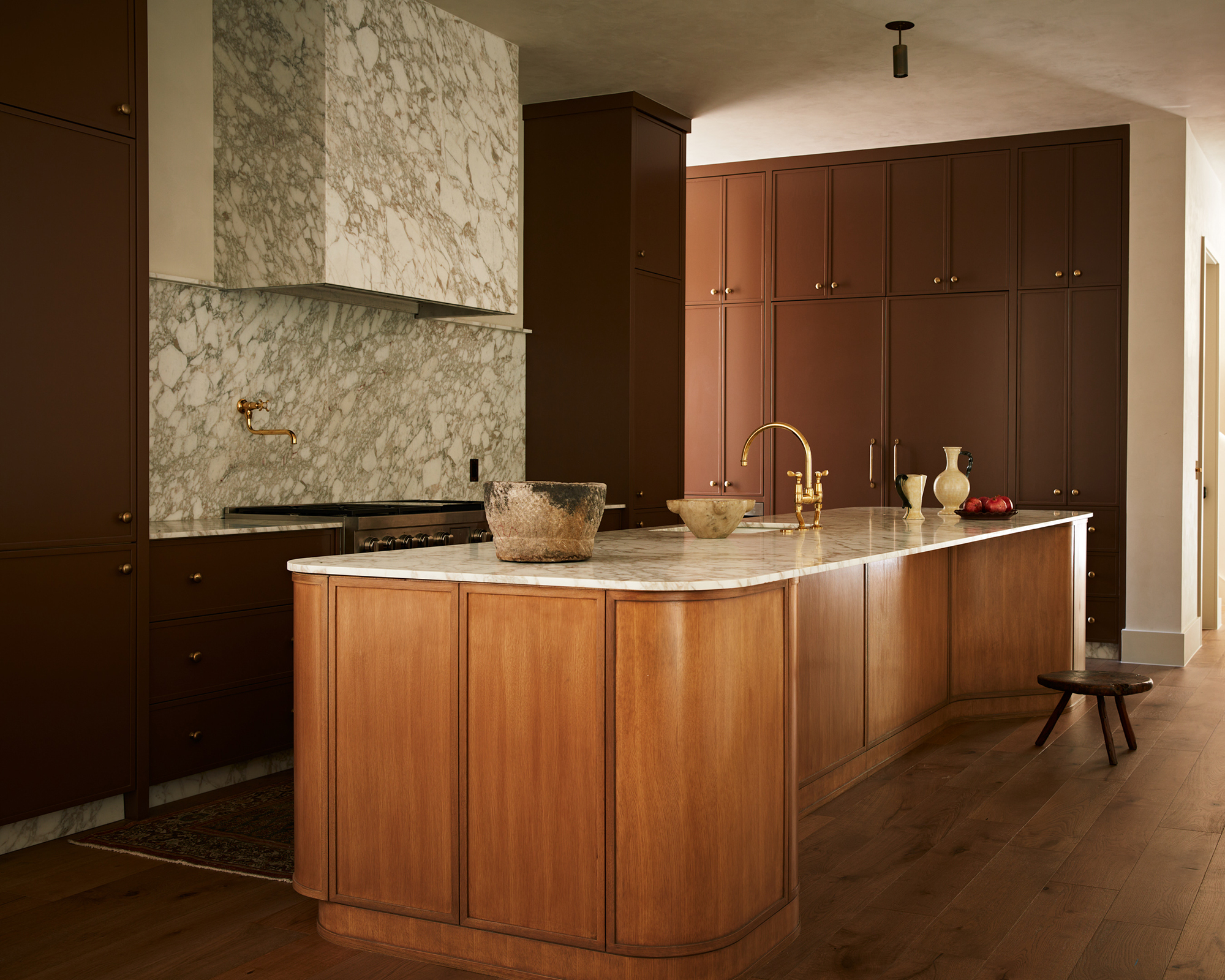 kitchen with brown cabinets and wood island